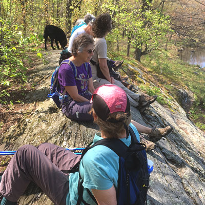 Group of hikers sitting to take a break