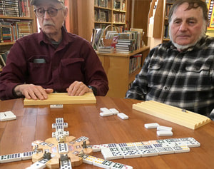 Two men playing the game of Mahjong